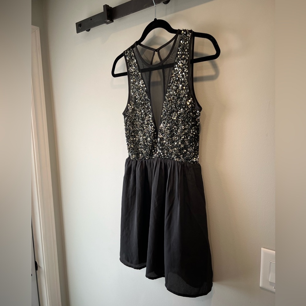 Forever 21 sequin and mesh, backless mini dress. Size small, gently worn once
